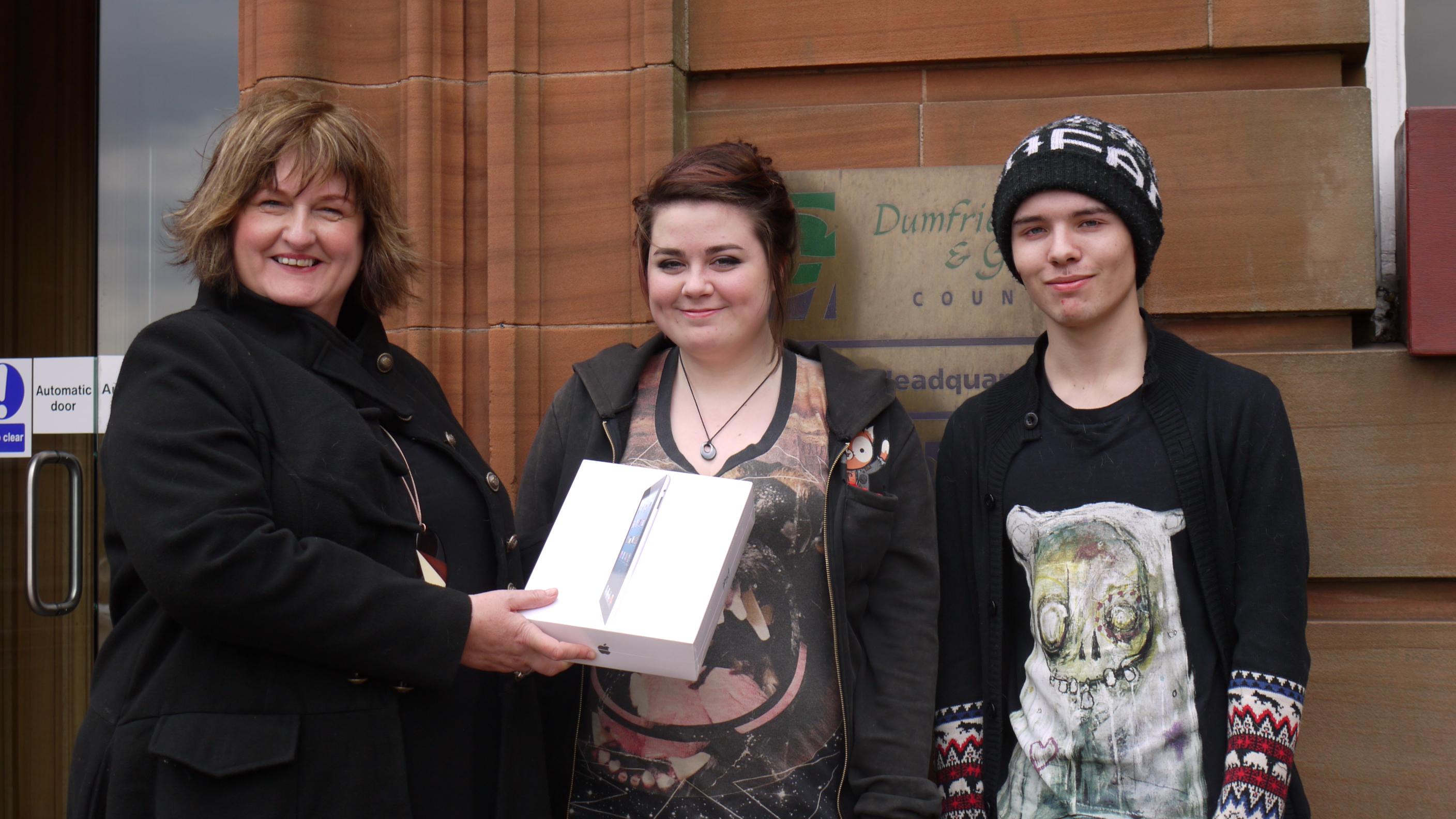 Left to right - Lindsey Mason, Young Entrepreneur Coordinator presents IPad to Mandy Kelly, Joshua Johnson